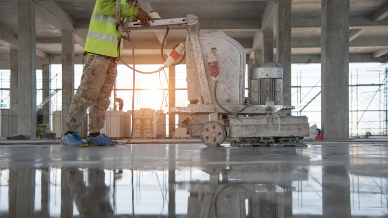 Worker polishing concrete floor