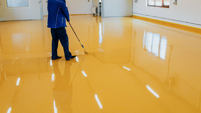 Worker polishing concrete floor