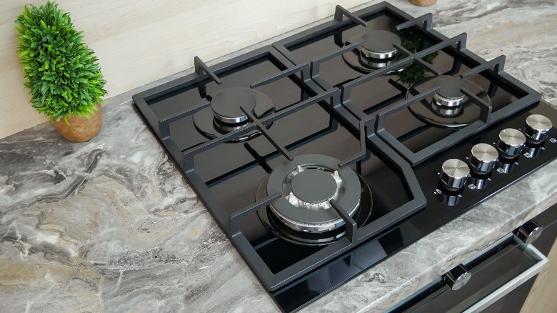 Gas range on granite countertop 