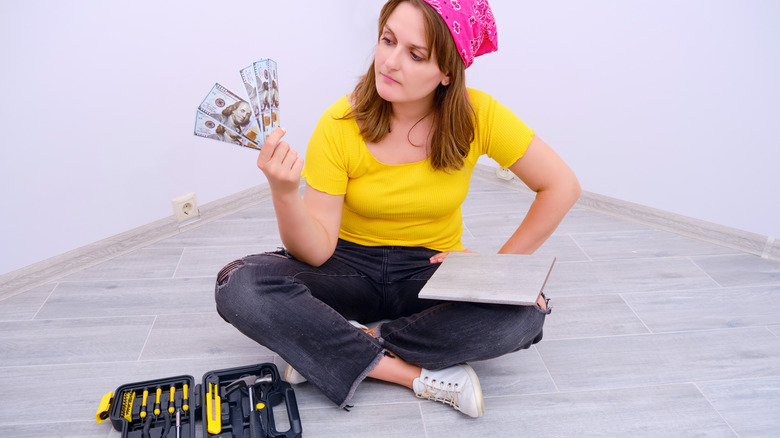 woman with dollars in hand