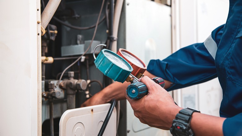 Person checking HVAC unit