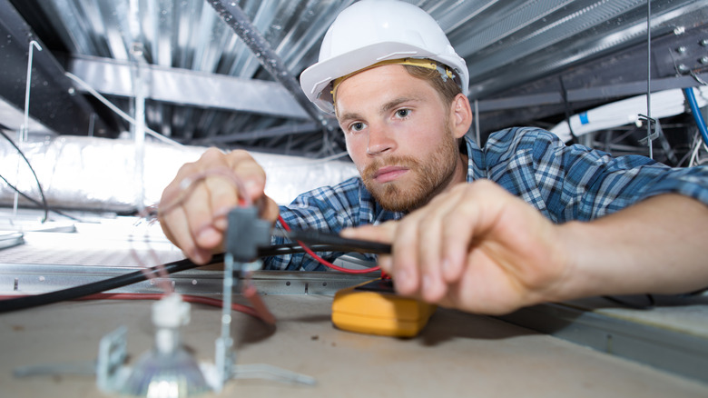 Electrician working with wires