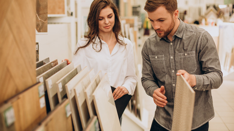 Man and woman shopping for tile