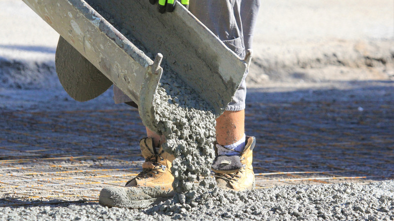 pouring concrete to lay a driveway