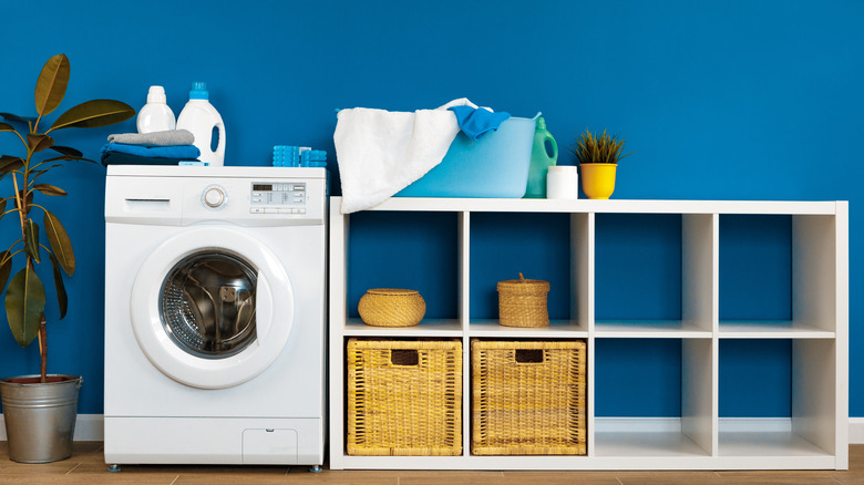 washing machine and blue wall