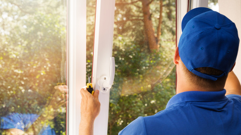 Professional replacing windows in home