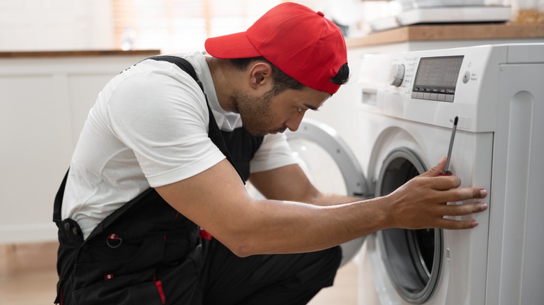 man installing washing machine