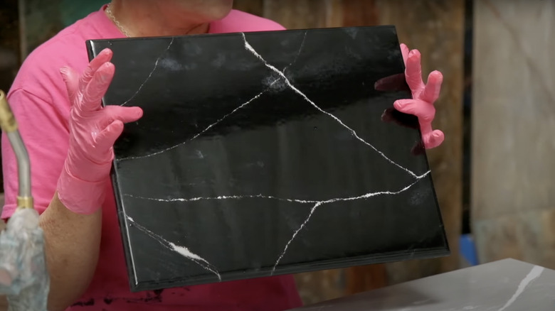 woman holding diy black soapstone slab