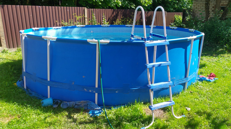 Above-ground pool in backyard