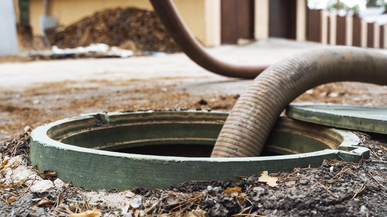 hose pumping a septic tank