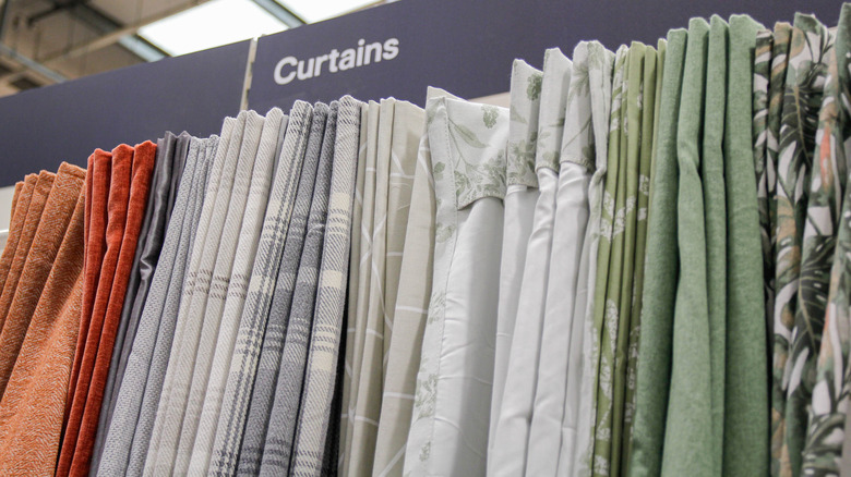 Selection of fabric curtains in a store