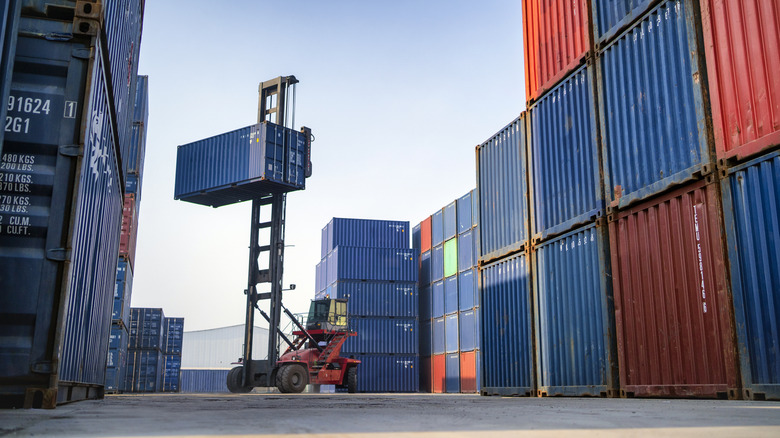 Machine moving shipping containers