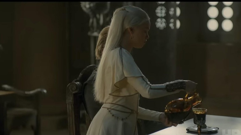 Rhaenyra pours wine at court