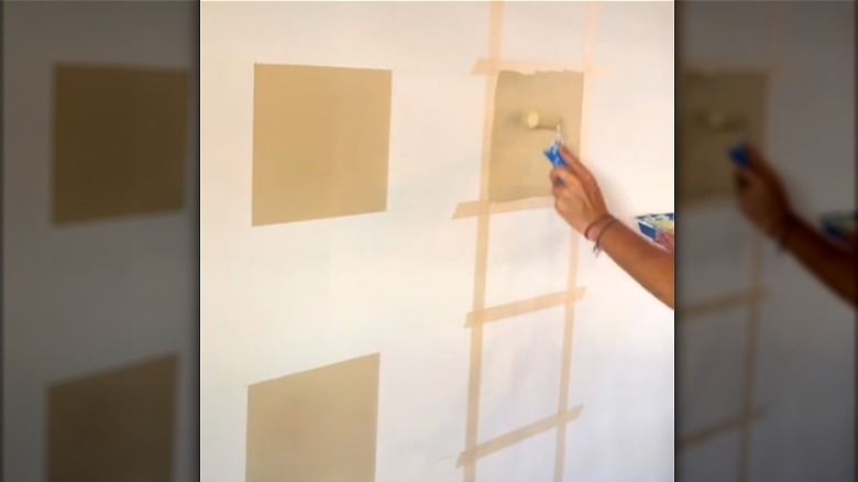 Hand painting taped wall squares