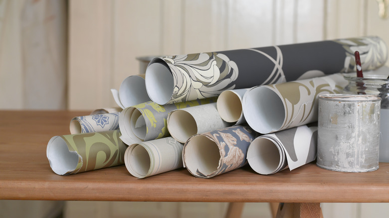 rolls of wallpaper and paint 