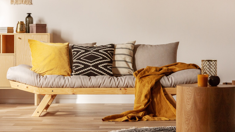 pillows arranged on bench 