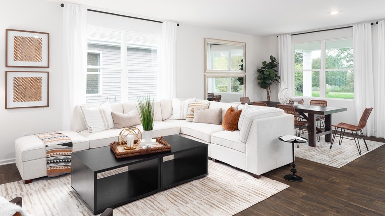 white sectional with neutral pillow