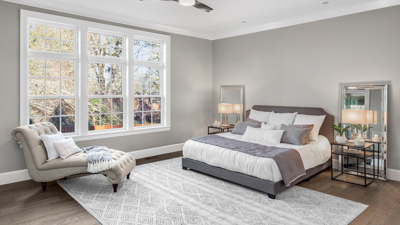 gray and white pillows on bed