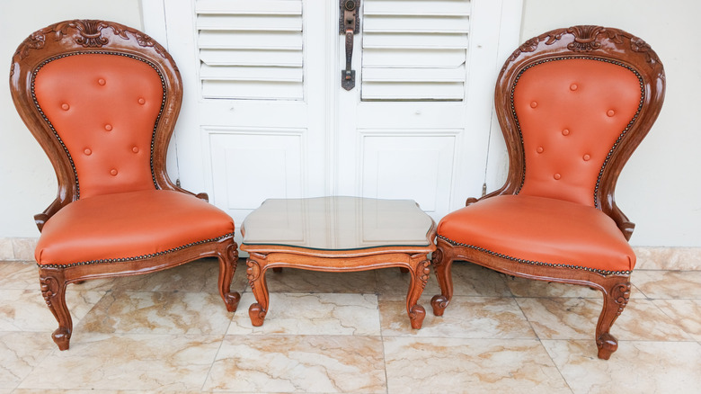 Set of antique brown leather chairs in a home