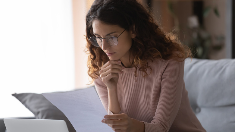 Woman examining contract