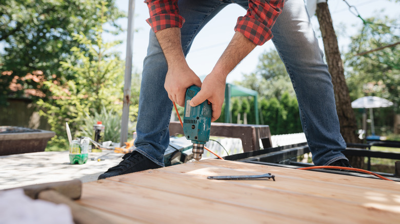 Someone working on constructing deck stairs