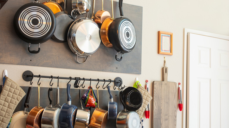 rack with hanging pots and pans