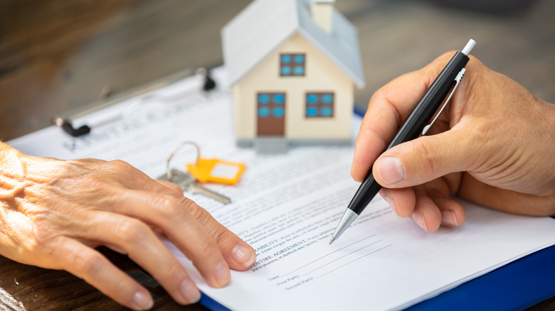 Signing a house's deed