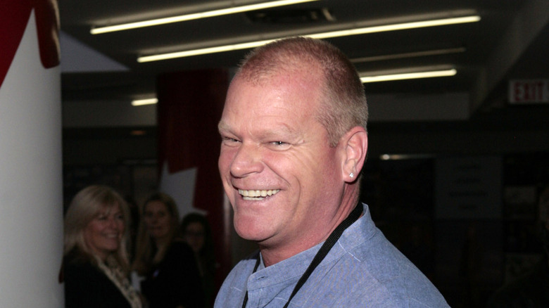 Mike Holmes smiling in a blue shirt