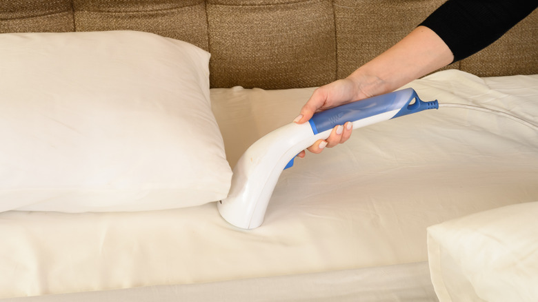 Using steamer on bed linens