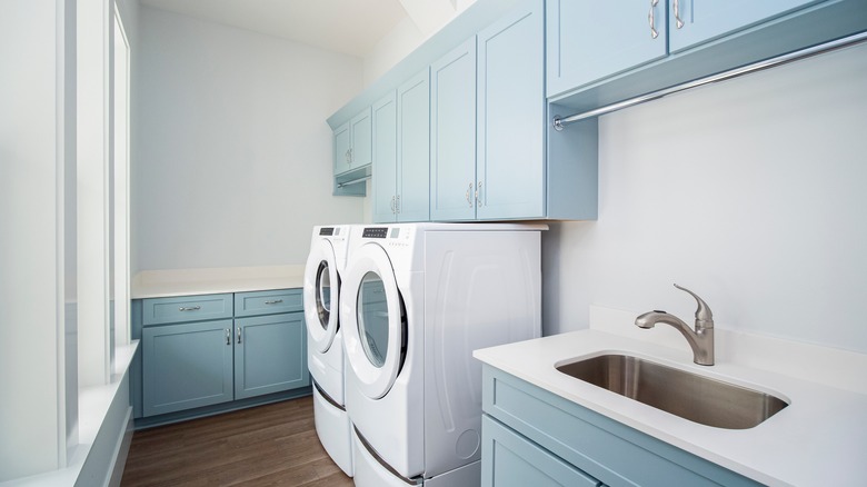 laundry room with white walls