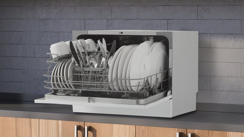 Open countertop dishwasher on counter