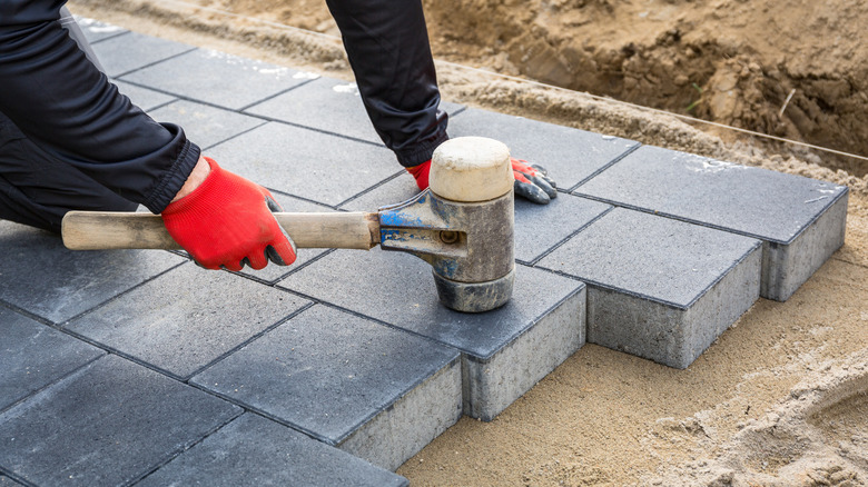 installing pavers with a rubber mallet