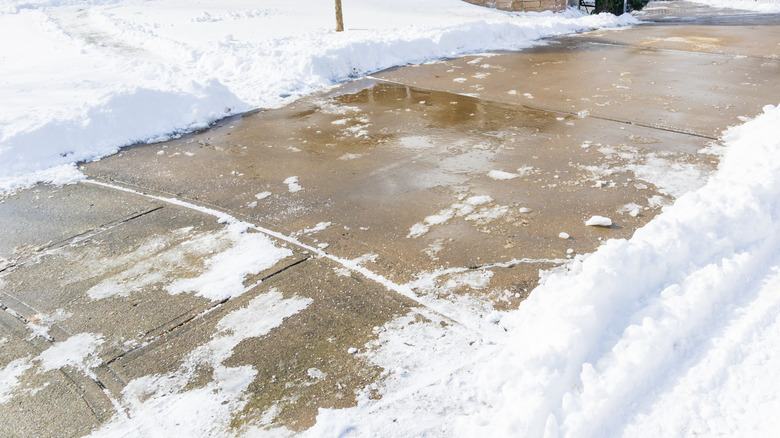 snowy concrete driveway