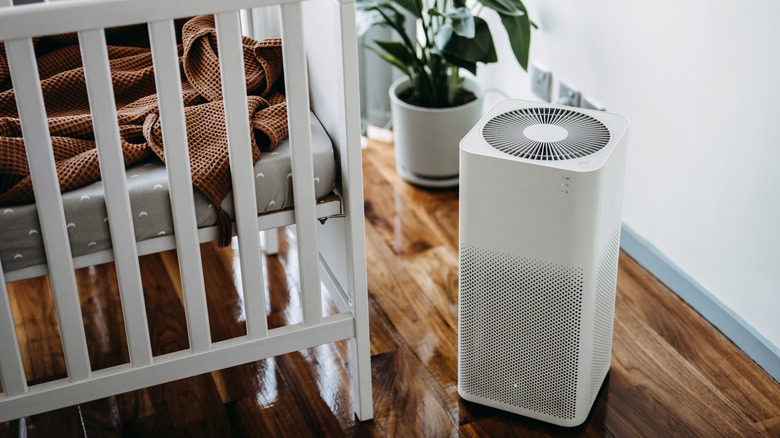 An air purifier near a crib