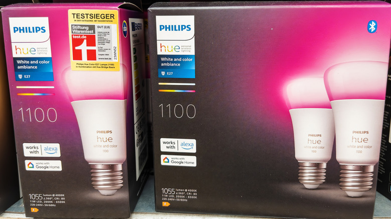 A Philips Hut White and color ambiance box sits on a store shelf