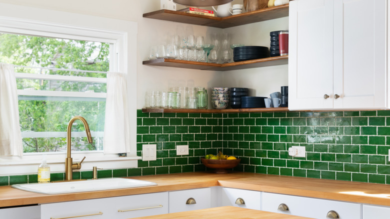 green kitchen backsplash with grout