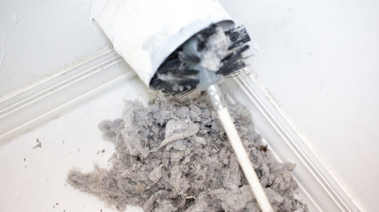 Cleaning brush used to gather lint and debris from dryer vent