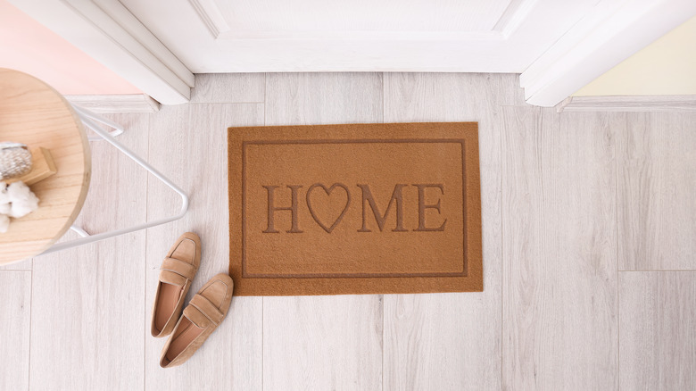 Welcome home mat by door