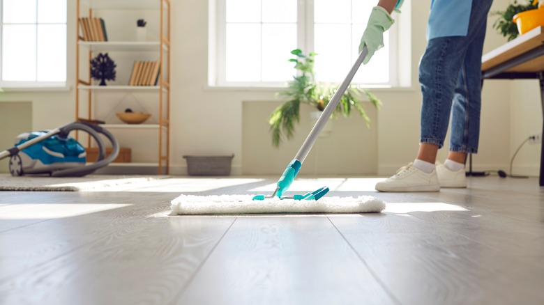 A person is cleaning the floors.