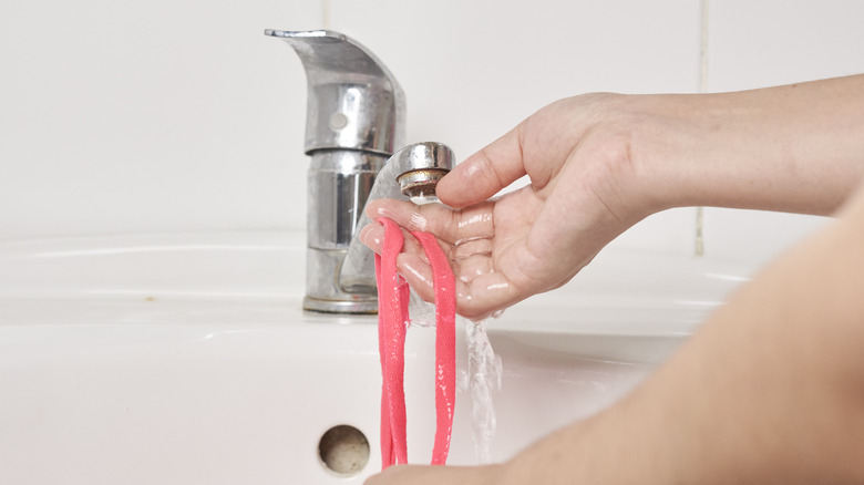 Shoelaces being cleaned