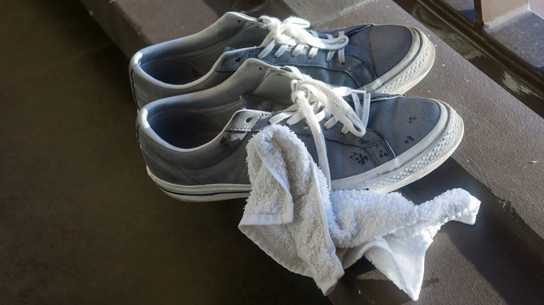 Sneakers with a damp white cloth