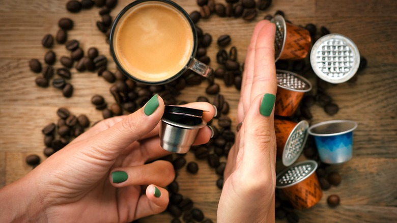 hand holding reusable coffee pod