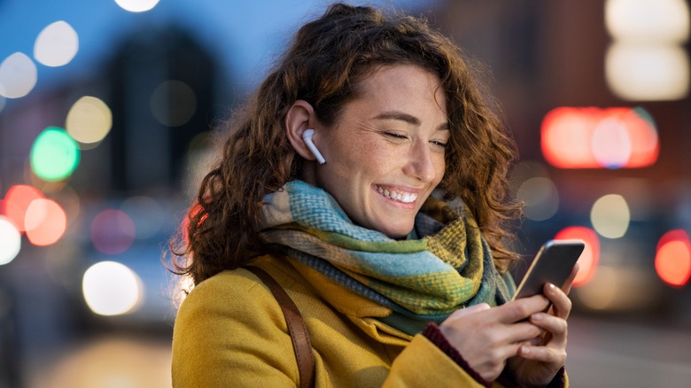 Woman has earbuds in ears