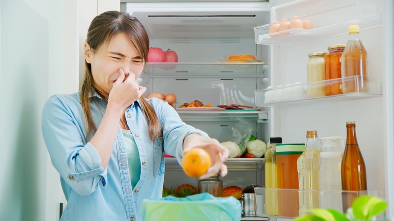 Person trashing spoiled food