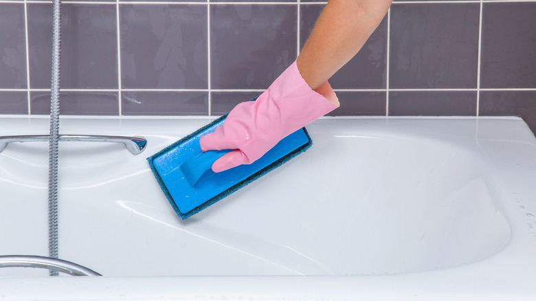 hand cleaning bathtub