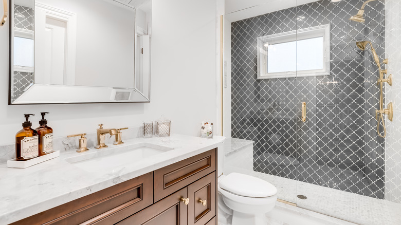 Gold, silver and white bathroom