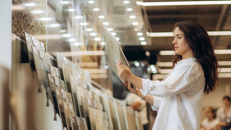 A woman shops for bathroom tile