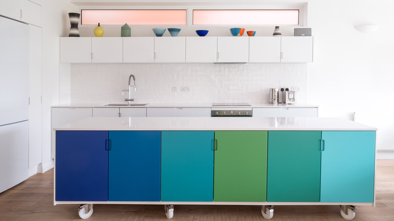 Colorful island in white kitchen