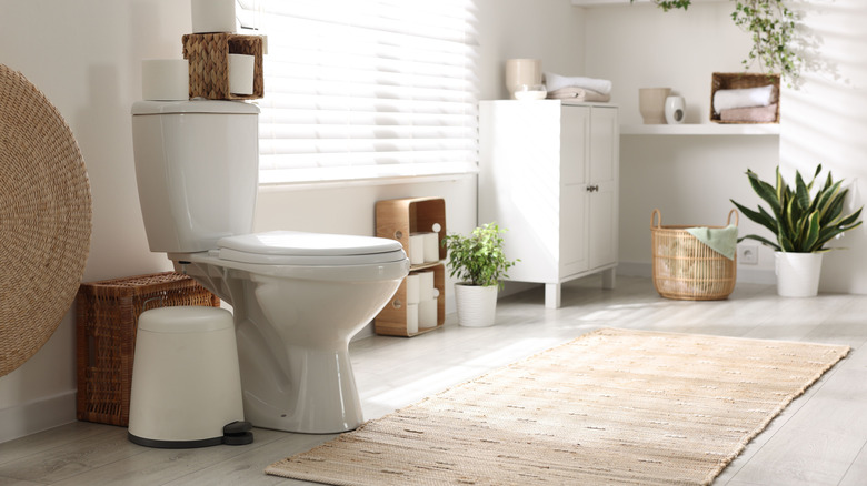 Older bathroom with a tile floor