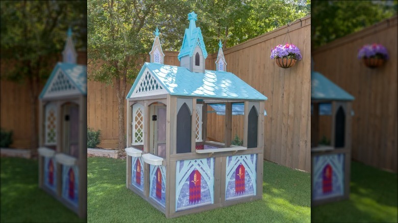 castle playhouse by a fence